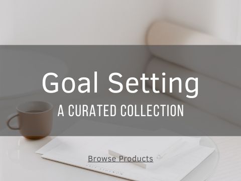 goal setting text on image of notepad and calendar on table.