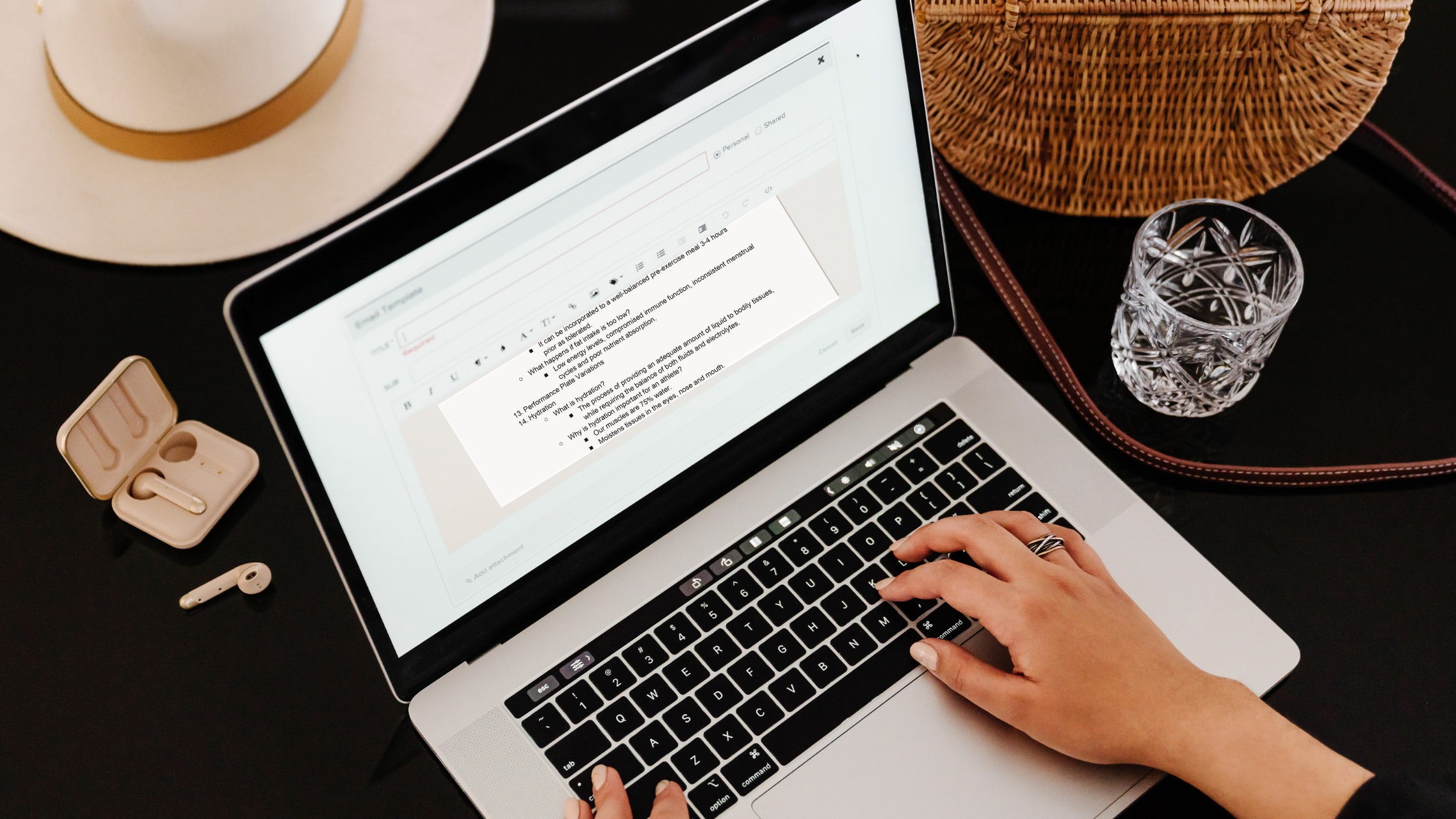 A dietitian on a laptop pursuing goal setting worksheets to use at her next client meeting
